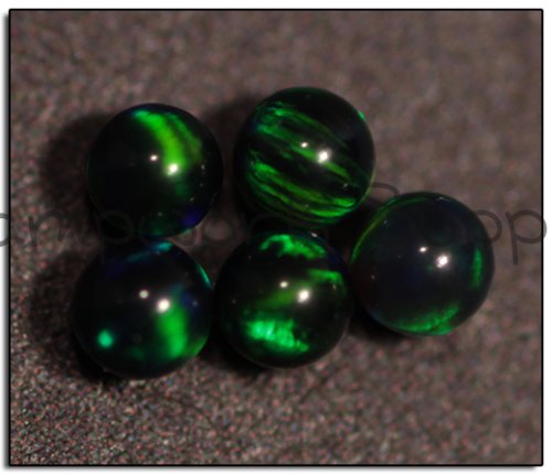 Kyocera 2mm Sphere Opal - Black Green Green Fire