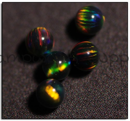 Kyocera 2.5mm Sphere Opal - Black Yellow Yellow Fire